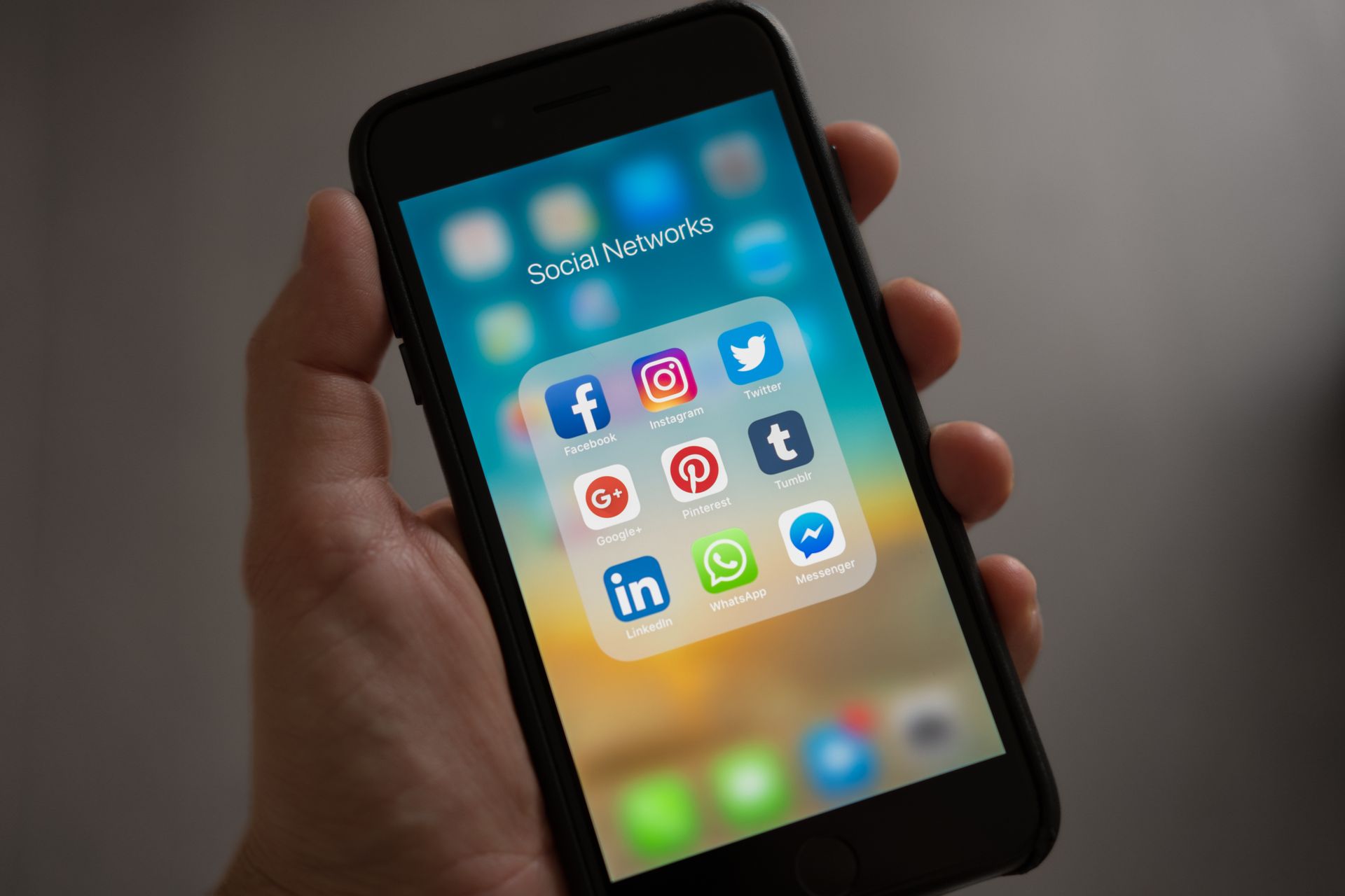 Phone displaying social media feed and content grid