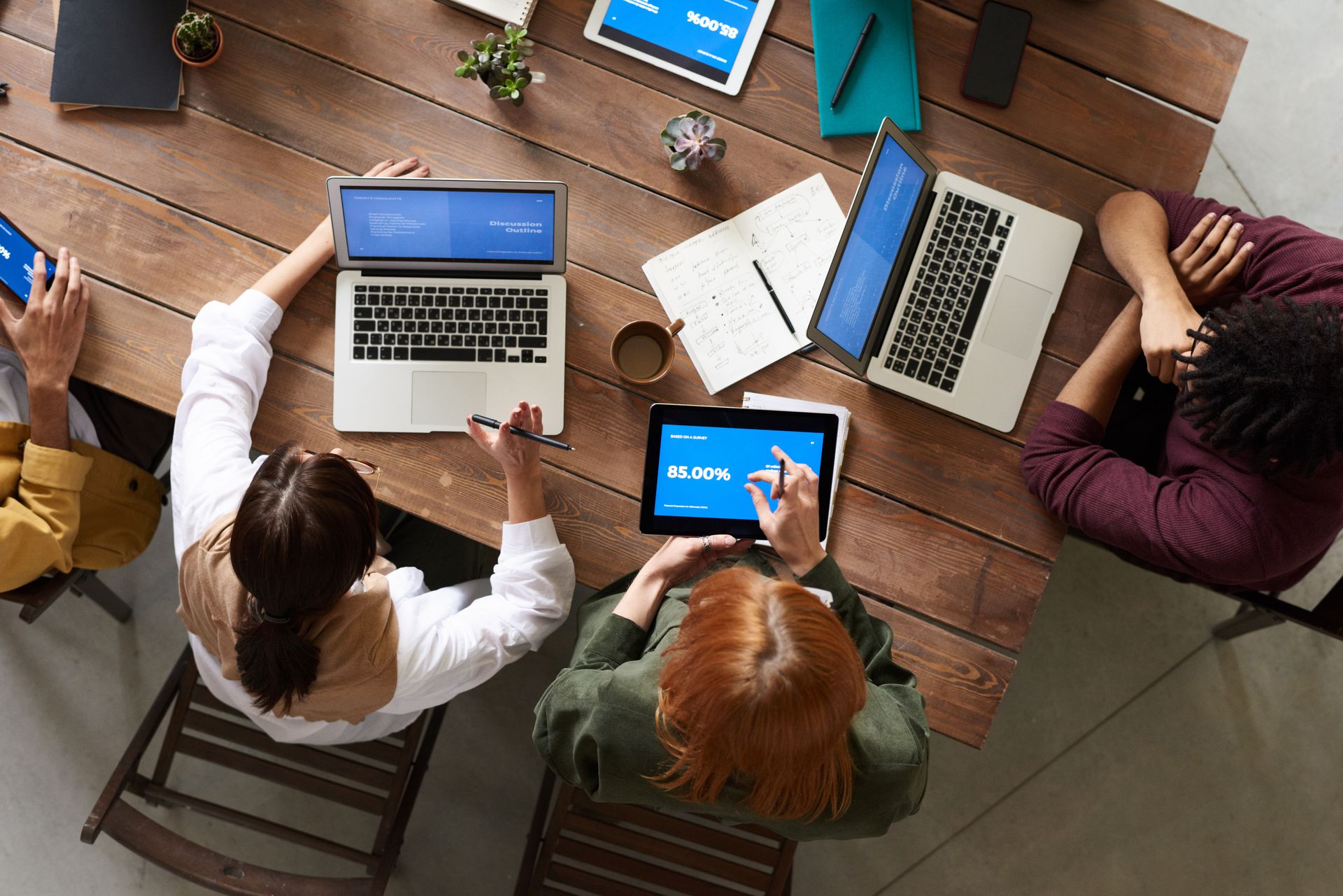 Group of people collaborating around a table
